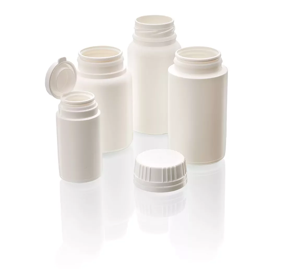Composition of white HDPE pill jars with snap and screw closures in different capacities