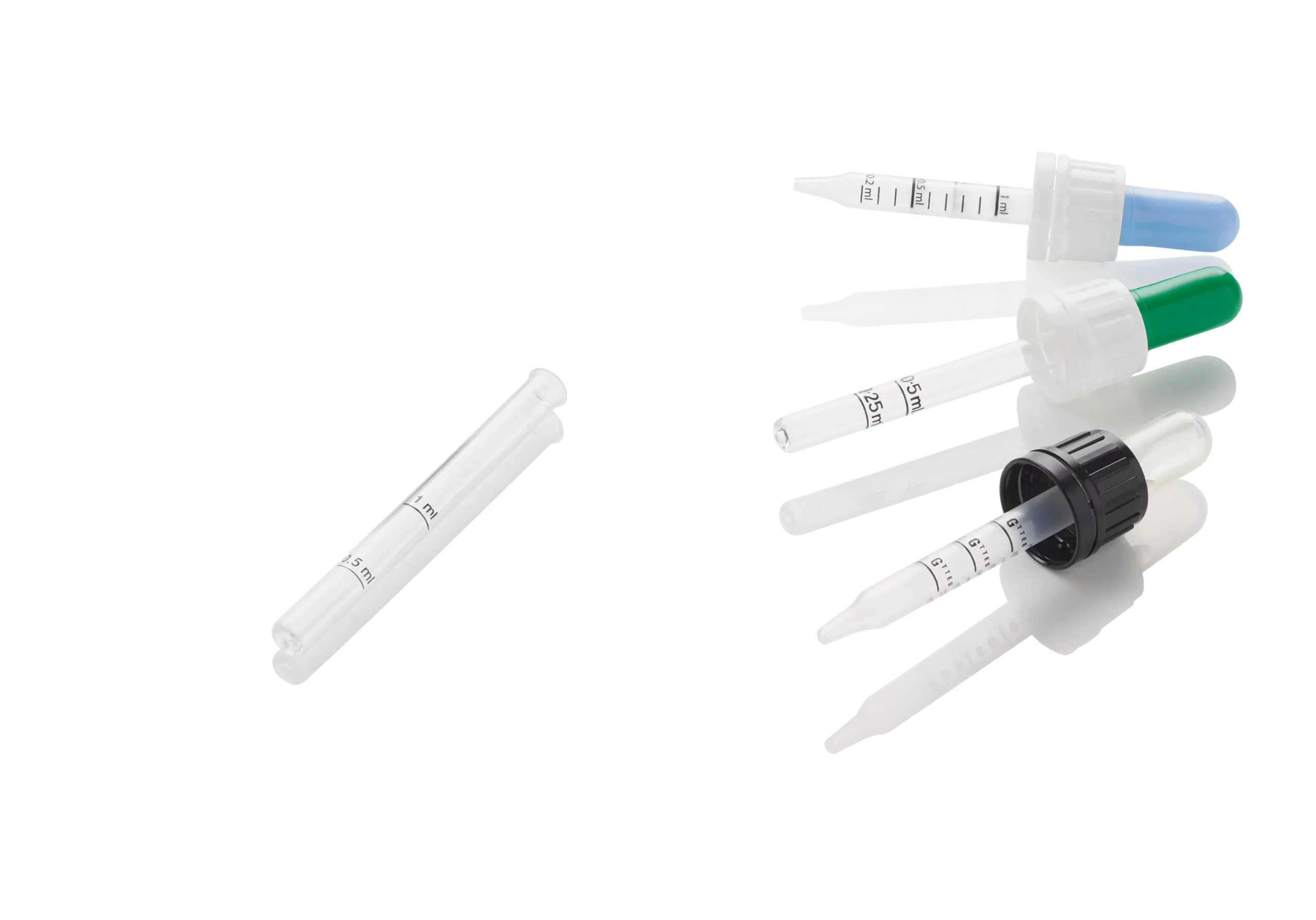 Three droppers mounted with glass or plastic pipette, white and black ring and blue, green and transparent teat with pipette on side only. All pipettes are marked.