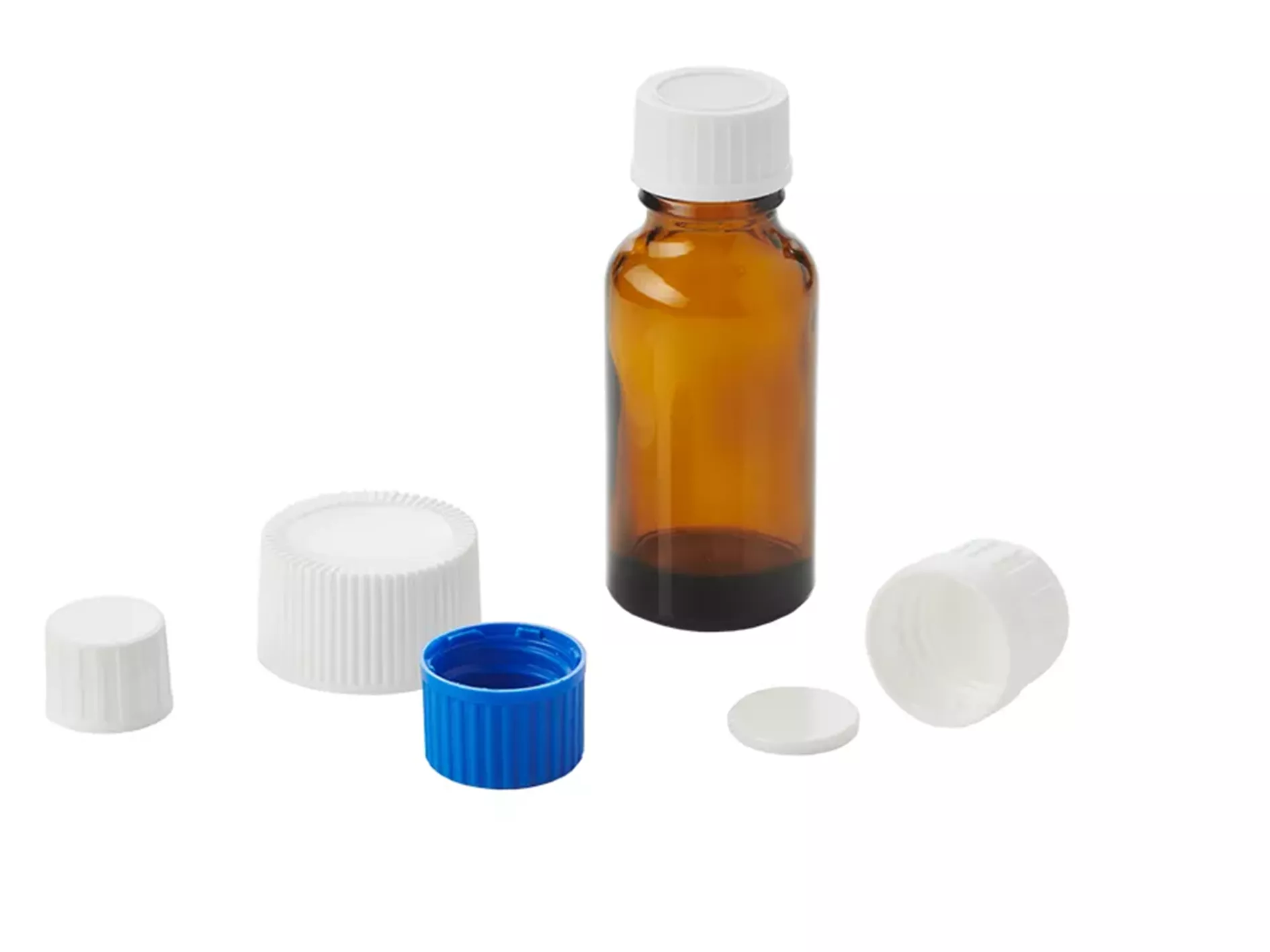 Composition of blue and white corks of different sizes with a screw cap on an amber bottle